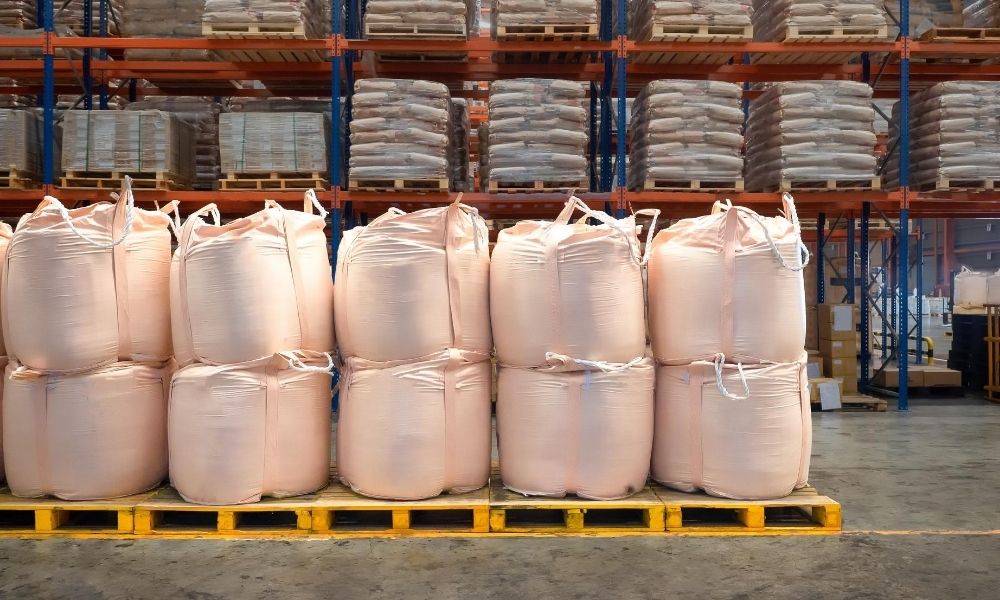 Bulk bags on a pallet in a warehouse.