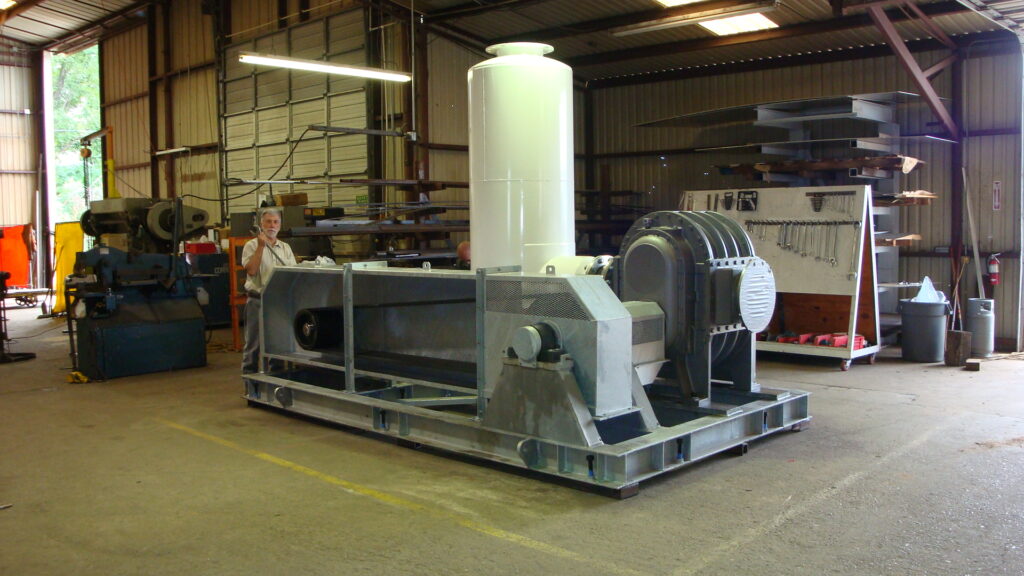 Our founder George Weissenberger standing next to a 500 horsepower